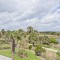 Beautiful Lake and Golf Course views from the rear 2nd floor balcony at this home in Cinnamon Beach.